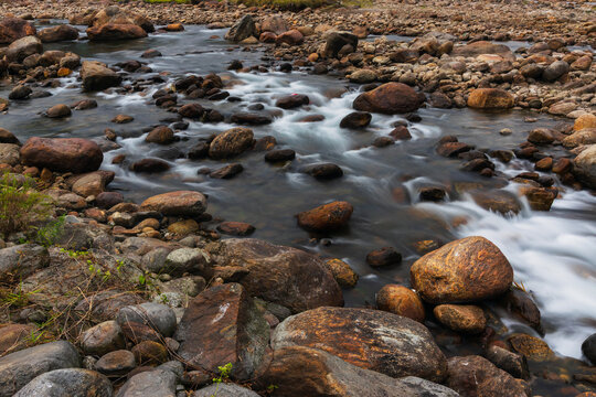 Jaldhaka River and stones at river bed, flowing through India, Bhutan, and Bangladesh. Originating from Kupup Lake in East Sikkim. Joldhaka river, Jhalong - Dooars , north bengal - West Bengal, India.