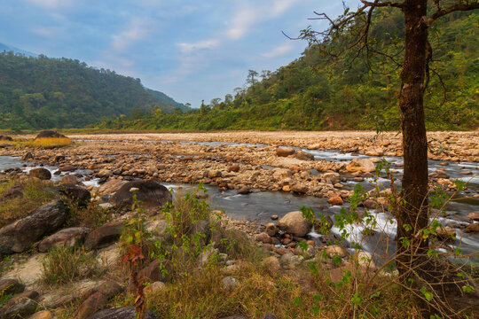 Scenic beauty of Jaldhaka River and stones at river bed, flowing through India, Bhutan, and Bangladesh. Originating from Kupup Lake in East Sikkim. At Jhalong-Dooars, north bengal- West Bengal, India.