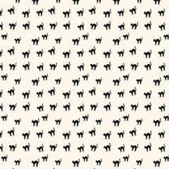 black cats pattern on beige background © MdRakibul