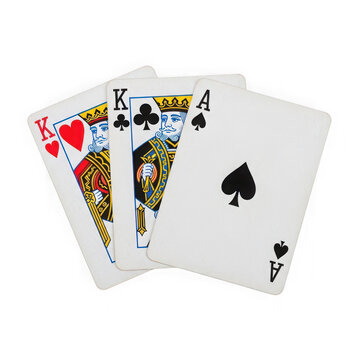 Three playing cards fanned out with king and ace cards