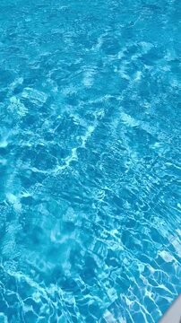 Abstract background Blue swimming pool water surface and ripple wave background. perfect for themes related to summer, vacation, purity
