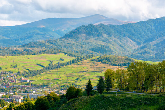 countryside mountain landscape in autumn. scenic rural area of ukraine in fall season. mountain path to volovets town in the valley. sunny afternoon