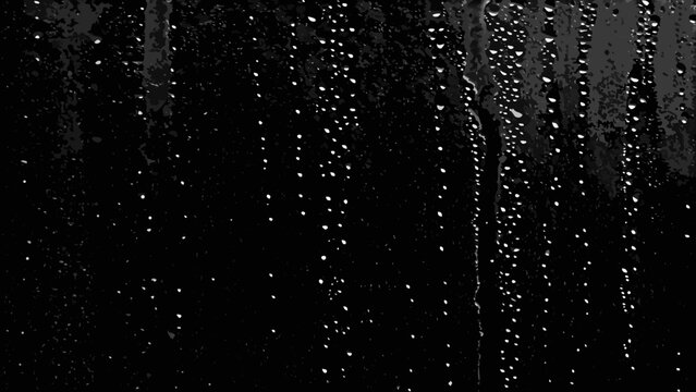 Water droplets on glass create a textured monochrome pattern with varying sizes and streaks condensation raindrops watermarks