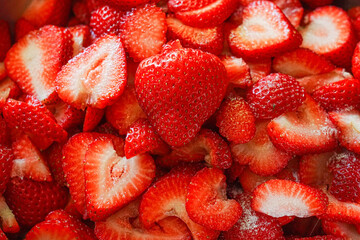 Close-up photograph of Fresh sliced strawberries ready to make into Strawberry Jam or for strawberry shortcake. © gchapel