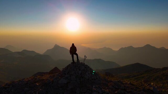 Sunrise Silhouette On Mountain Peak