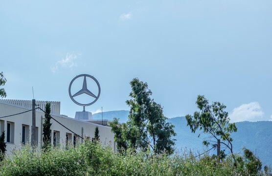 Athens,Greece-July 14 ,2019.Mercedes Benz logo placed on the roof of a building.