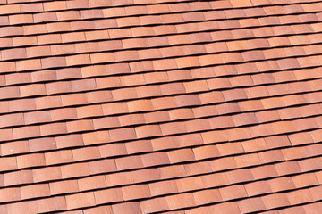 Curved clay tiles on a roof in the city of Chester, Cheshire, England UK © Stephen
