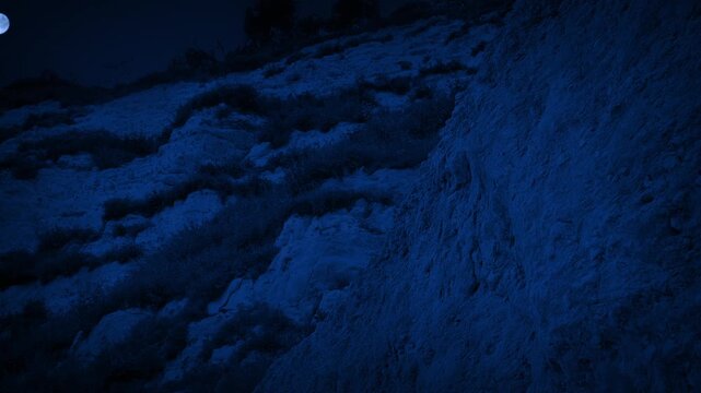 Steep Cliffs With Moon Above At Night
