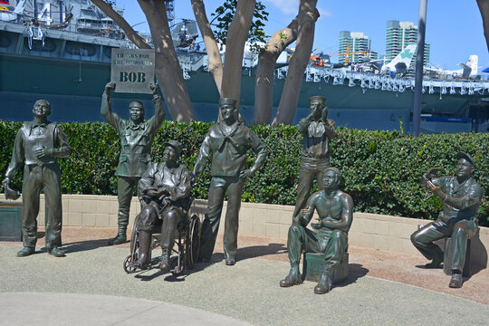 SAN DIEGO California  USA: Bronze statues of A National Salute to Bob Hope and the Military. On the plaza, there are 15 bronze statues, arranged as if attending a Bob Hope show. 