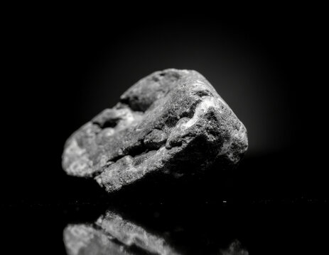 broken rock exposing bright quartz and metallic mineral veins with dramatic lighting and geological textures.