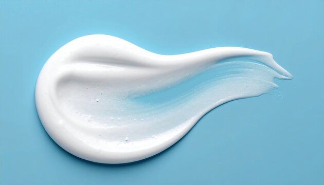 White skincare cleansing foam texture on light blue background, minimal cosmetic concept