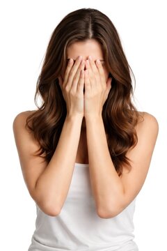 Young woman covering face with hands, expressing embarrassment