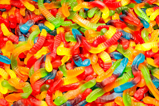 Colorful gummy candy worms  as a background