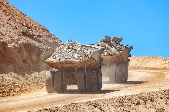 Huge dump trucks loaded with mineral
