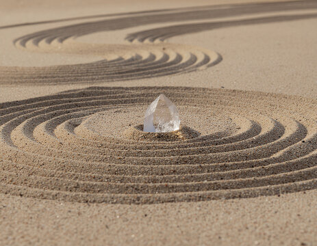 minimalist landscape featuring a transparent quartz crystal rising naturally from untouched desert sand illuminated by warm sunrise light