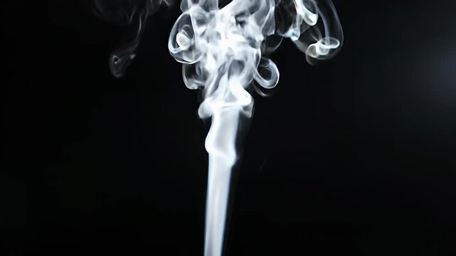 Vertical white smoke trail on black background.