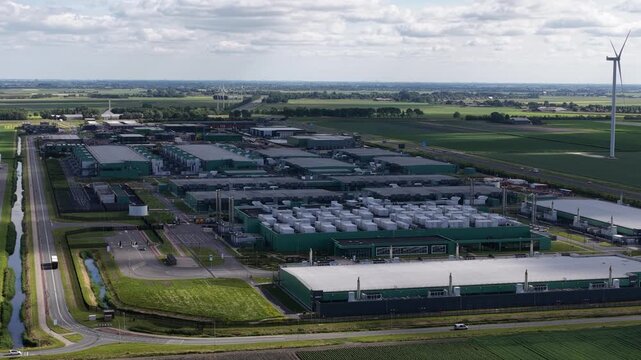 Aerial view of data center campus with wind turbine