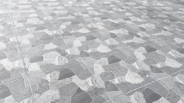 Grey stone pavement tiles pattern and texture background