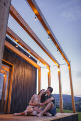 Naklejka na ściany i meble Romantic date for young couple in small cottage in nature.