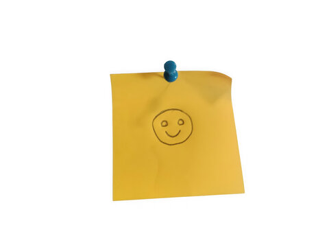Yellow sticky note with a happy face drawing