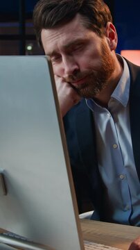 Sleepy bored Caucasian 40s business man working computer yawning at night office overtime late boring middle-aged businessman male entrepreneur yawn work internet desktop suffer burnout lack of energy