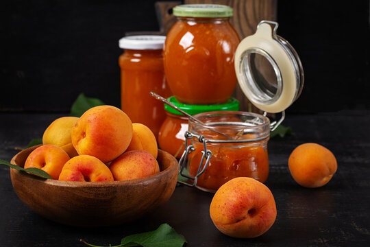 Homemade Apricot Jam in Glass Jars with Fresh Apricots