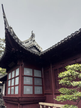 Yu Garden pavilion with tiled roof, carved eaves, and lattice windows in Shanghai, China
