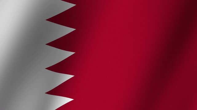 Bahrain Flag Waving: The national flag of Bahrain, with its serrated white and red pattern, waves proudly in the breeze, symbolizing national pride and identity.