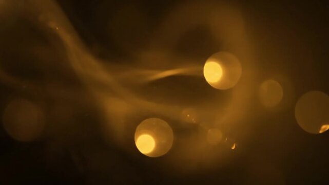 Golden yellow light leak flare on black background