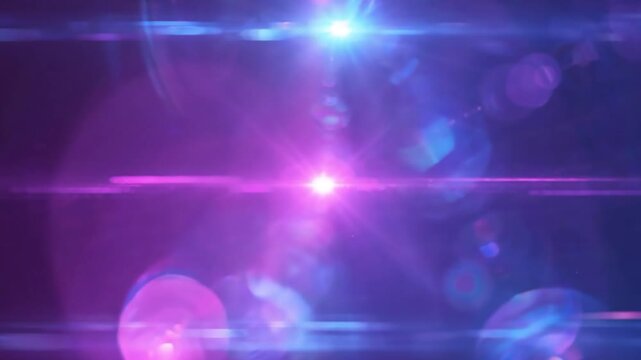 Blue and purple light lens flare on dark background