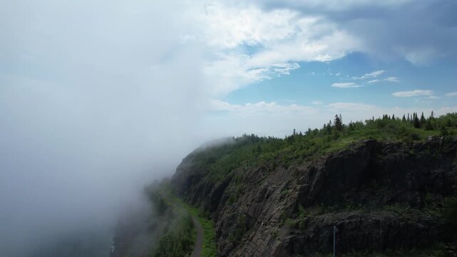 Rising Aerial of North Shore Minnesota North of Duluth on the coast of Lake Superior. Fog rolls off the water.