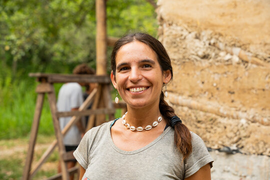 Portrait of woman at sustainable natural building site