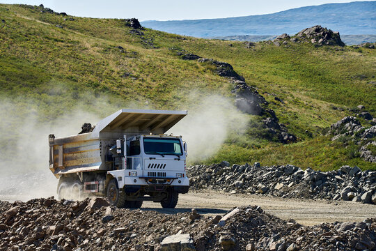Dump truck moving through a copper mine landscape