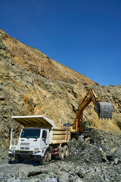 Heavy machinery operating in an open-pit copper mine