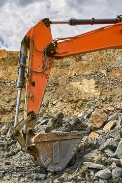 Excavator working in an open-pit copper mining site
