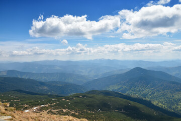 Fototapeta premium Panoramic view of Carpathian Mountains with forest and dramatic clouds in summer