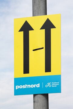  Assens, Denmark - August 14, 2025: PostNord Danmark Rundt signboard and direction. PostNord Danmark Rundt is a Danish multi-day professional road cycling race