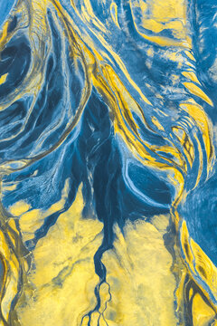 Vibrant abstract nature texture in blue and gold tones