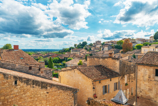 Stone buildings and narrow streets of Saint-Emilion surrounded by vineyards in famous French wine region, Bordeaux, France. Wine tourism, medieval town in Nouvelle-Aquitaine