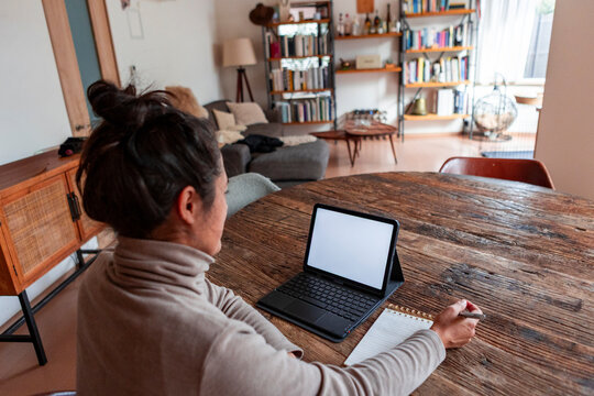 Woman working from home in a cozy living space
