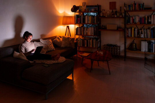 Woman remote working comfortably at home