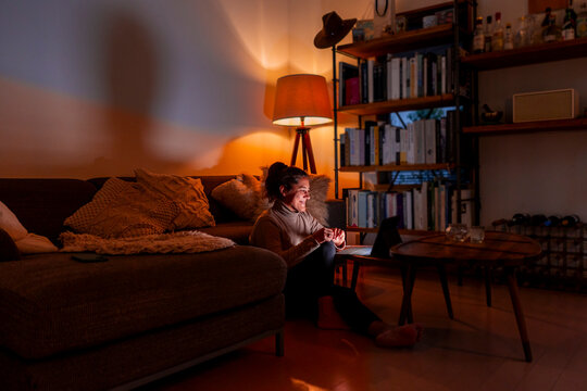 Woman working comfortably from her cozy living room