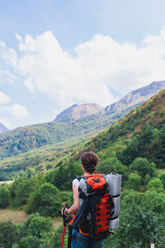 Female hiker on mountain trail in Somiedo, Asturias, Spain