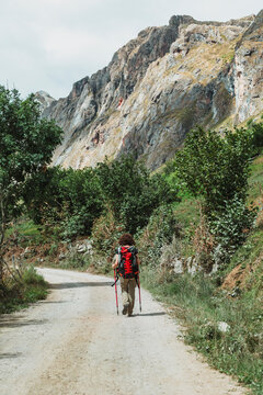 Female hiker on Somiedo mountain trail in Asturias, Spain