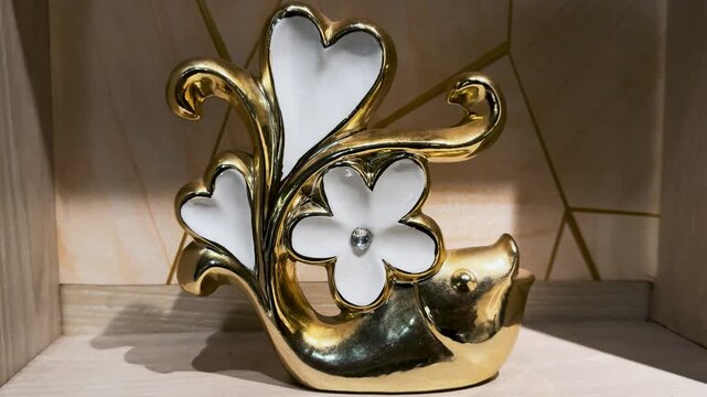 Decorative gold and white ceramic fish figurine