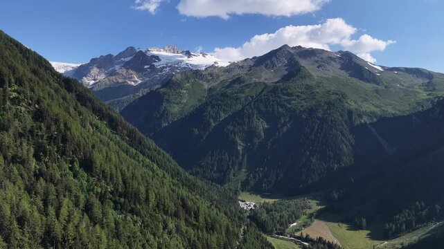 serene high-altitude mountain range with clear skies and green valleys, aerial view from a high vantage point, nature and adventure travel destination, vibrant green and blue landscape, ahh.
