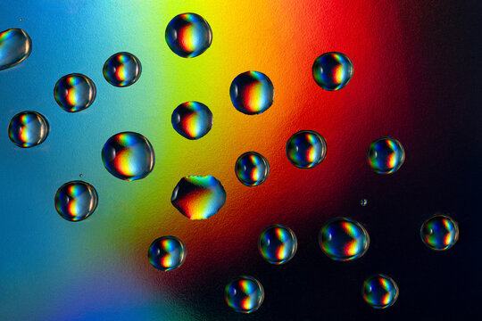 Vibrant neon droplets on a colorful background