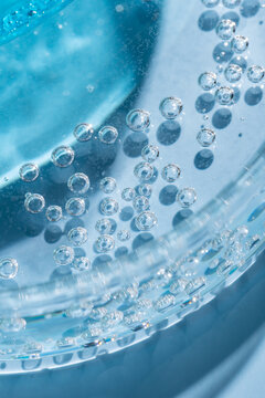 Abstract blue gel bubbles in laboratory glassware closeup