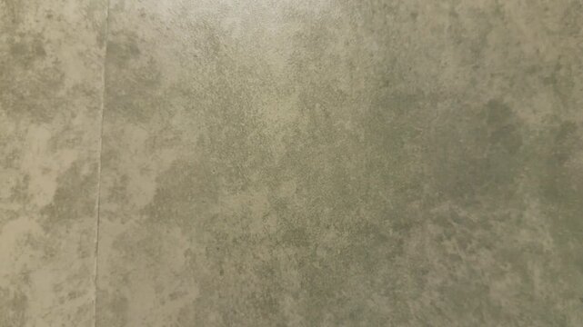 Textured gray surface with mottled pattern