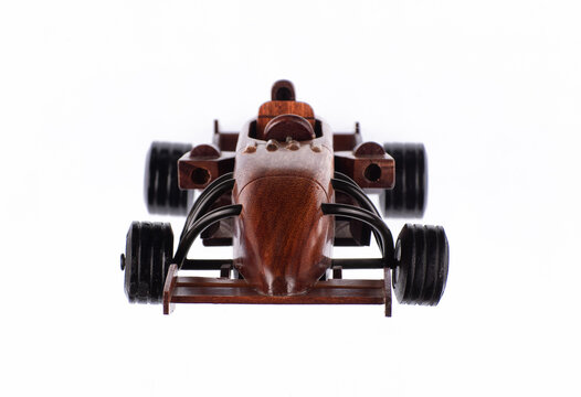 Wooden sports car toy isolated on white background